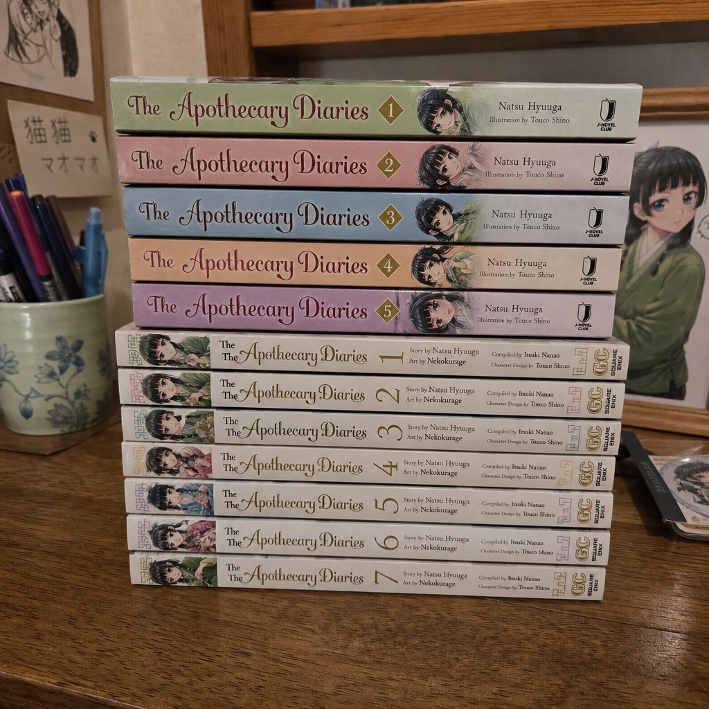 The Apothecary Diaries light novel and manga volumes compared on a bookshelf